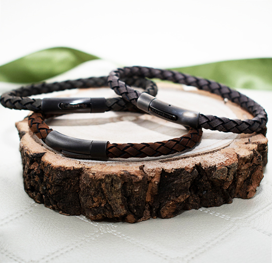 Leather bracelets sitting on wooden block