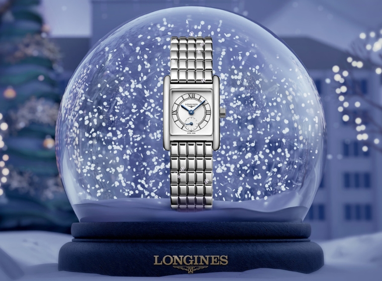 ladies longines watch sat in a snow globe