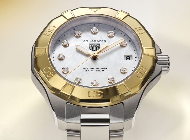 A ladies steel and gold bezel aquaracer watch