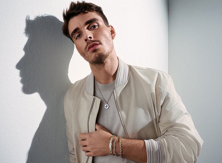 BOSS grey tone necklaces and bracelets being modelled 